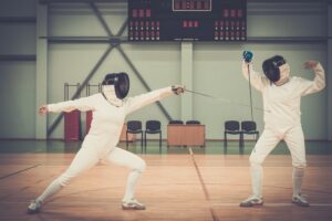Two women fencers on a training